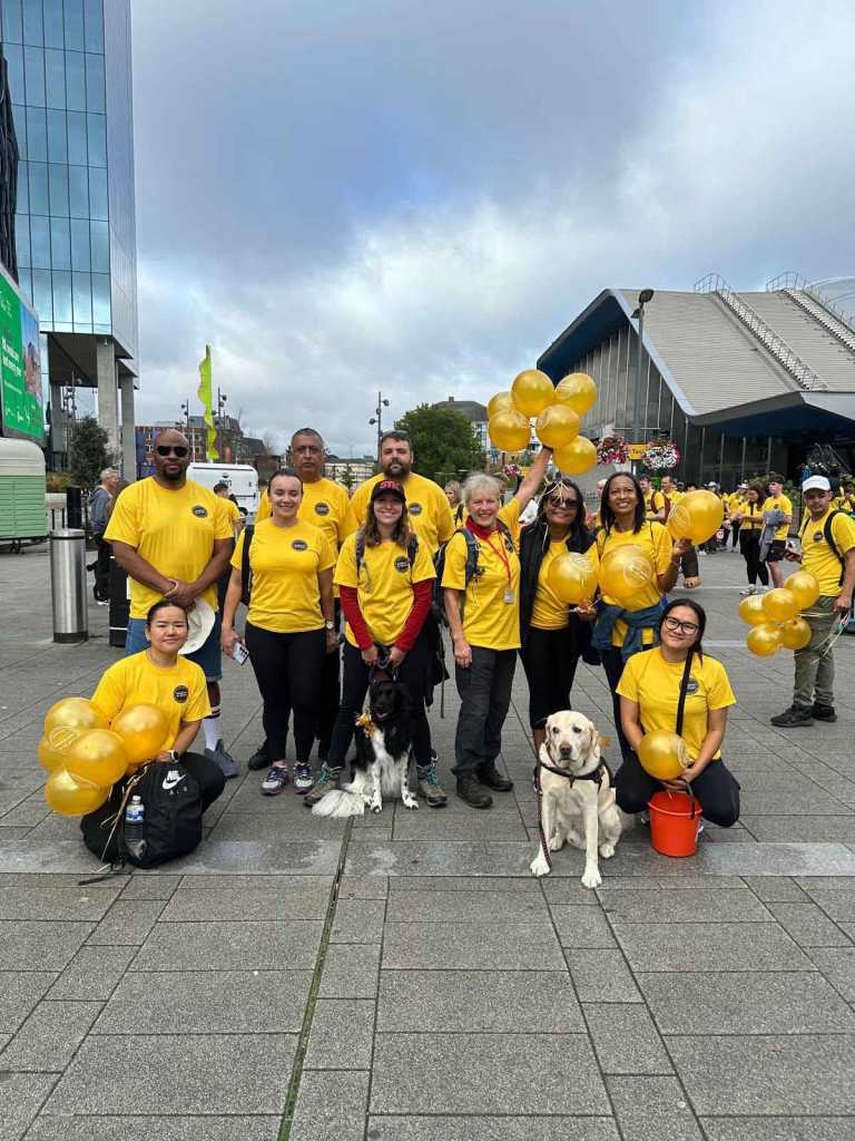 a group of people and dogs on the Reading Station plaza