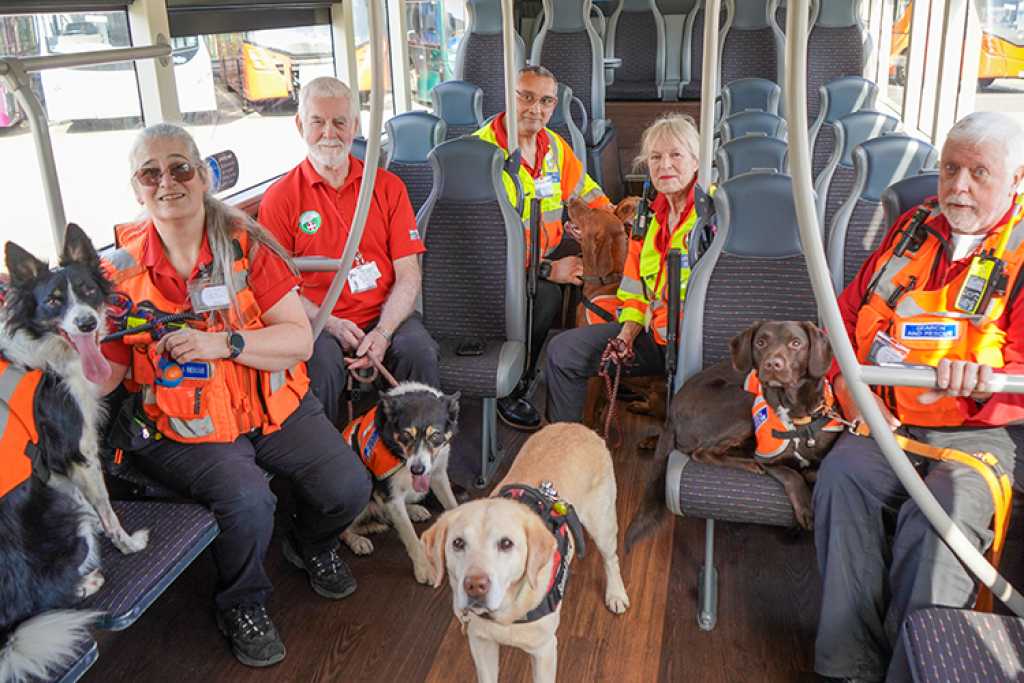 rescue dogs and handlers onboard the bus
