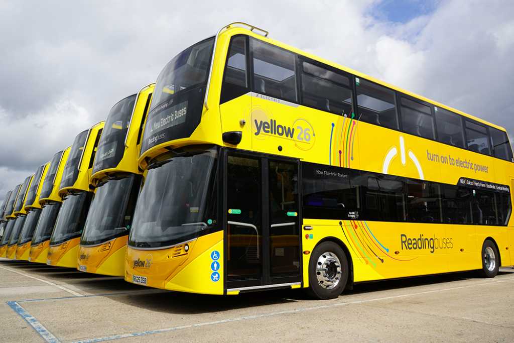 a line up of yellow buses